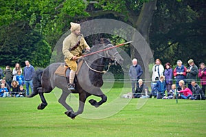 Demonstration of the sport of Tent Pegging at full gallop by a member of the Punjab Lancers in World War One uniform