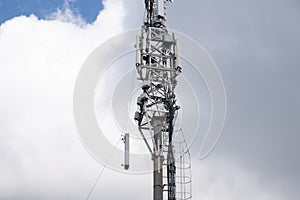 Demount or mount equipment on telecommunication tower of 4G and 5G cellular. Macro Base Station. 5G radio network