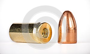 Demounted bullet shell set on gray background