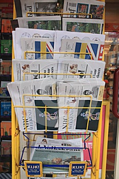 Den Bosch, The Netherlands, 14-12-1991: A newspaper rack filled with 7 different newspapers found in small stores in the