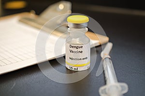 Dengue vaccine vial with a syringe