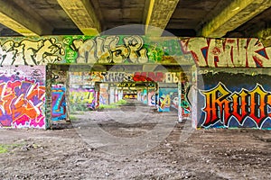 DENHAM, ENGLAND- 18 July 2021: Graffiti at the Uxbridge Wall of Fame underneath the A40 motorway
