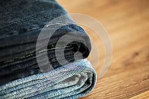 Denim blue jeans stack texture background closeup.