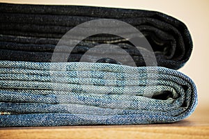 Denim blue jeans stack texture background closeup.