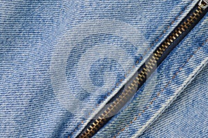 Denim blue jeans texture background with closed zipper