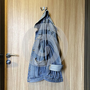 Denim jacket hanging on a hook