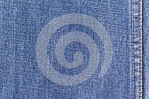 Denim jeans fabric texture background with seam for clothing, fashion design and industrial construction concept