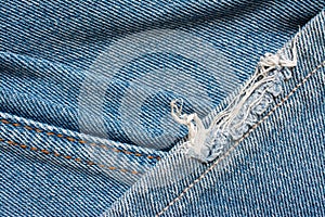 Denim jeans texture, cotton fabric. Pocket and rivet. Textile background