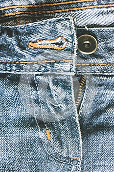Denim pants to unfasten the zipper close-up