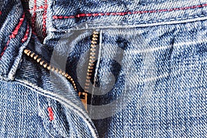 Denim pants to unfasten the zipper close-up