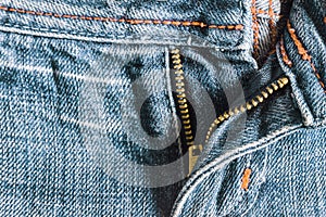Denim pants to unfasten the zipper close-up