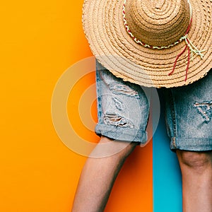 Denim shorts and straw hat. minimal style urban fashion