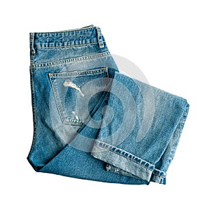 Denim trousers, made of jeans, folded neatly, fashion trends, isolated on a white