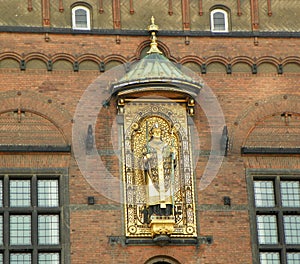 Denmark, Copenhagen, City Hall Square, Copenhagen City Hall, gilded statue of Absalon on the facade of the building