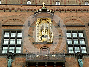 Denmark, Copenhagen, City Hall Square, Copenhagen City Hall, gilded statue of Absalon on the facade of the building