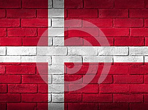 Denmark flag painted on a brick wall.