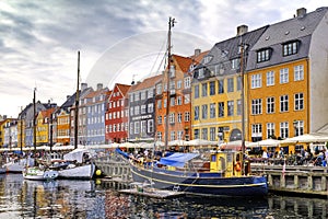 Denmark - Zealand region - Copenhagen city center - panoramic view of the Nyhavn district with boats and tenement houses along the
