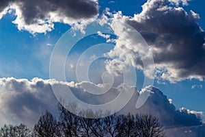 Dense beautiful clouds floating in the blue sky