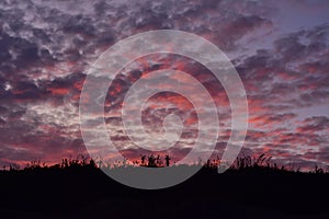 Dense colourful clouds after sunset