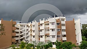 Dense dark clouds over a building