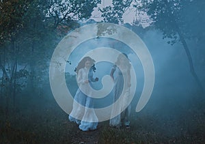 Frightened girls in vintage dresses photo