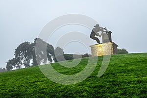 Dense fog over Napa County and the Wine Crusher Statue in Napa, California