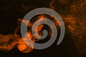 dense fumes abstract orange smoke dark background. High quality photo