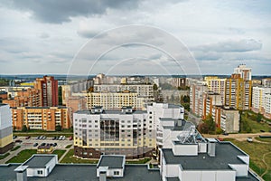 Dense urban development. A modern area of the city with beautiful multi-colored multi-storey buildings. Top view of the sleeping