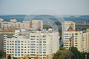 Dense urban development. A modern area of the city with beautiful multi-colored multi-storey buildings. Top view of the sleeping