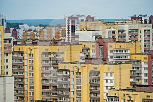 Dense urban development. A modern area of the city with beautiful multi-colored multi-storey buildings. Top view of the sleeping