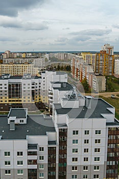 Dense urban development. A modern area of the city with beautiful multi-colored multi-storey buildings. Top view of the sleeping