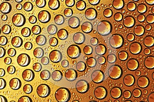 Dense water drops on orange background