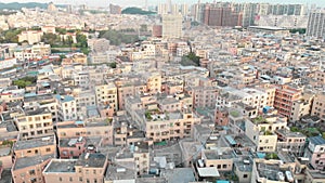 Densely built Chinese area on the background of modern buildings