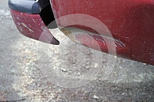 Dent near rear bumper of a truck