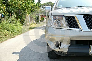 A dent on the right front of a pickup truck