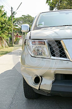 A dent on the right front of a pickup truck