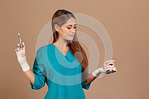 Dental anesthesia or puncture cyst tooth concept photo. Doctor dentist holding syringe, pursuing dental anesthesia