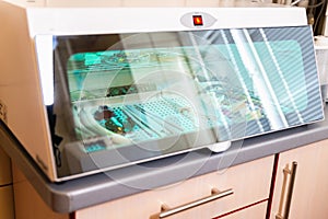 Dental appliance sterilizer for sealing and sterilizing appliances