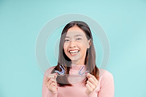 Dental Beautiful smiling of young asian woman with retainer braces glad emotion