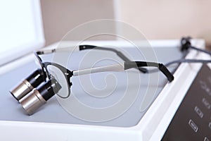 Dental binocular glasses. Dental magnifier. Dentistry and the concept of dental care. Modern dentistry.