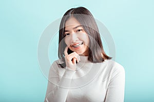 Dental braces of young asian woman wearing braces beauty smile with white teeth