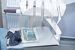 dental bur machine with attachments, instruments and disposable gloves. .