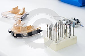 Dental burs and dental articulator in a lab.