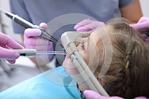 Dental care for children. Superficial sedation. Treatment of children`s teeth with nitrous oxide. Photos in the interior of the