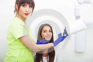 Dental care. Woman doing x-ray at dental clinic.