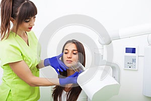 Dental care. Woman doing x-ray at dental clinic.