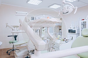 Dental clinic interior with modern dentistry equipment. Dental office. White tone