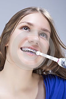 Dental Concept and Ideas. Closeup Portrait of Caucasian Teenage Girl with Teeth Braces