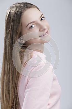 Dental Concepts. Portrait of Happy Teenage Female With Teeth Braces