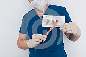 Dental doctor with a sugar gummy showing the process of tooth decay